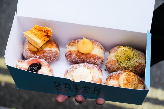 Christmas Delights: Festive Tea & Doughnuts at Borough Market - Walking through Borough Market between bites