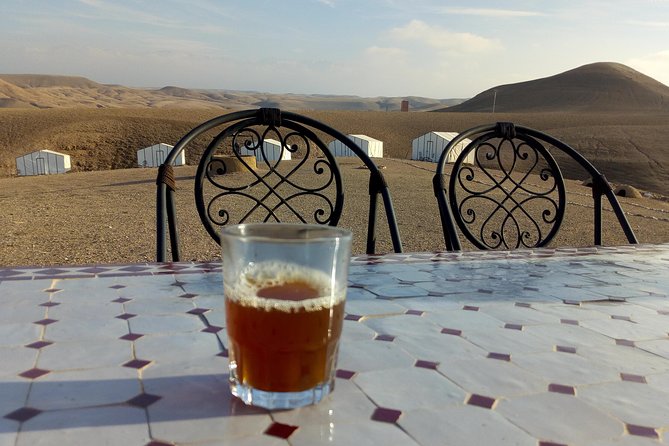 Desert Sunset Camel Ride With Free Tea in The Desert Camp - Mounting up for the sunset camel ride