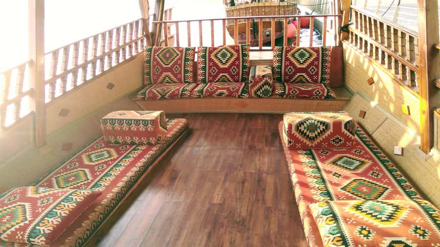 Dubai: Sunset Cruise on Traditional Boat & Emirati High Tea - Canal views, bird sanctuary, and dhow yards