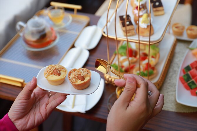 Huong River Afternoon Tea Cruise Tour Along Hue City - Tea, fruit, cake, and Vietnamese-style snacks